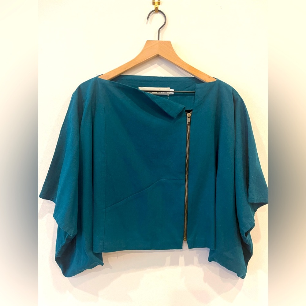 Rectangular mid section cover to wear over a dress or shit as an extra layer.